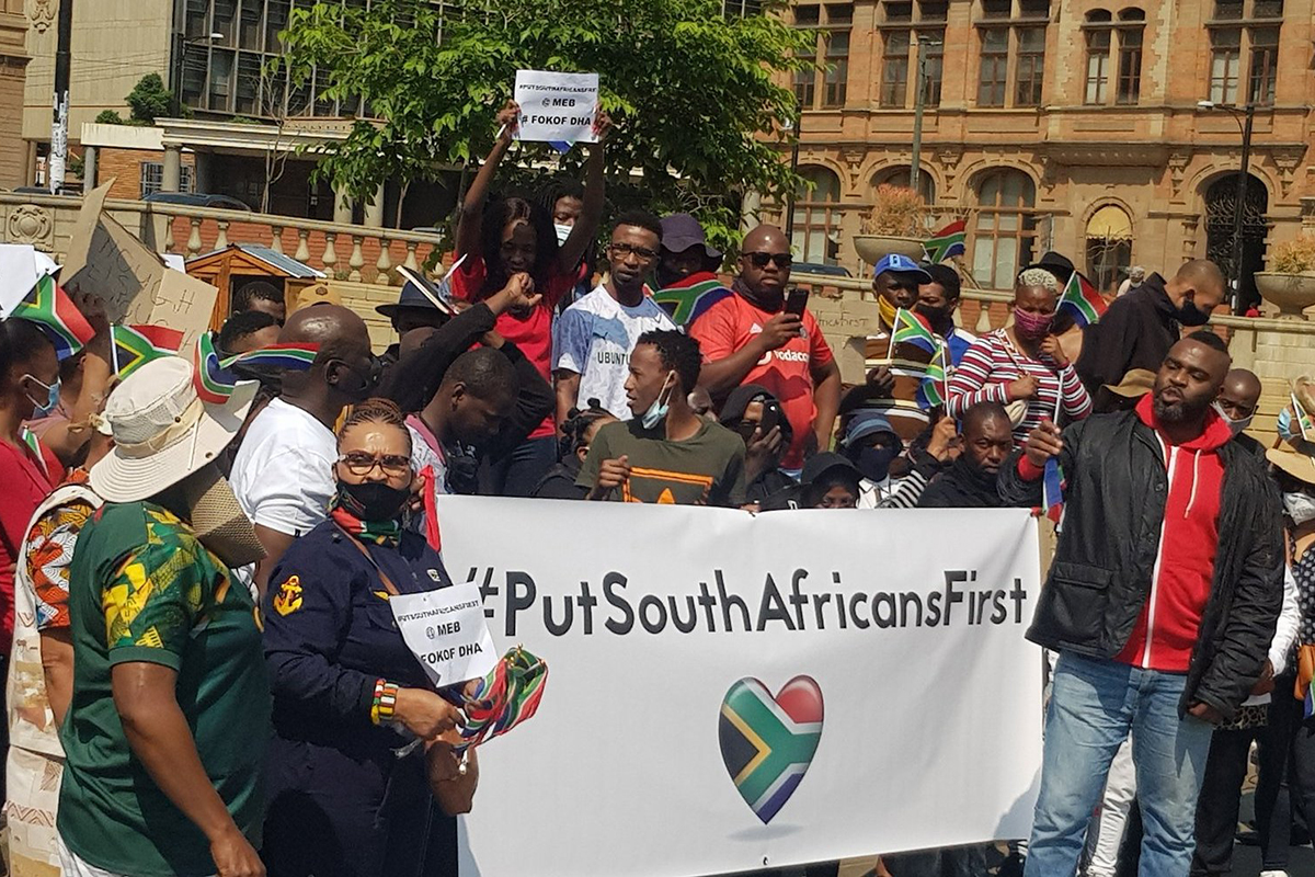 Put South Africans First banner at community gathering