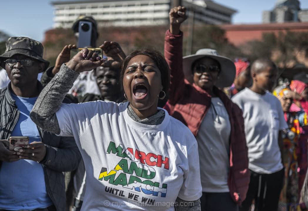 Passionate citizen activist raising fist at March & March demonstration